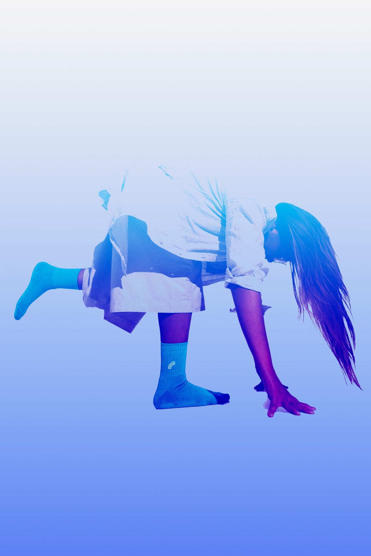 person in cool tones looking downwards